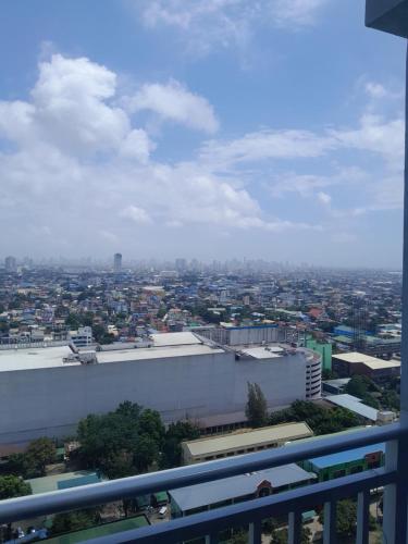 a view of a city from the top of a building at Grass residences in Manila