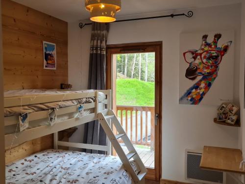 a bedroom with a bunk bed and a window at Appartement Valmorel, 3 pièces, 5 personnes - FR-1-356-422 in Valmorel