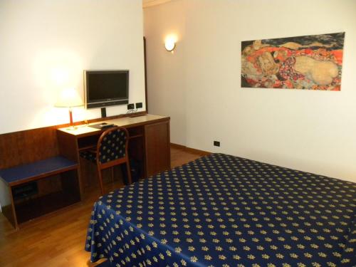 Postel nebo postele na pokoji v ubytování Arcotel