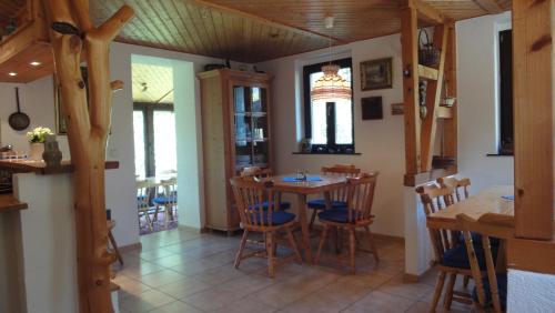 a dining room with a table and chairs at TRIXI´S GUESTHOUSE in Hřensko