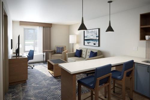 a room with a kitchen and a living room at Candlewood Suites DFW Airport North - Irving by IHG in Irving