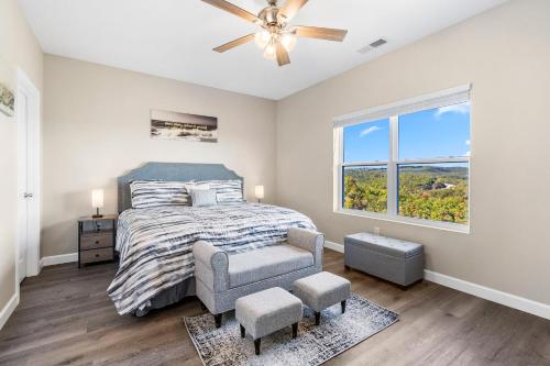 a bedroom with a bed and a ceiling fan at Vineyards Escape 3 in Branson