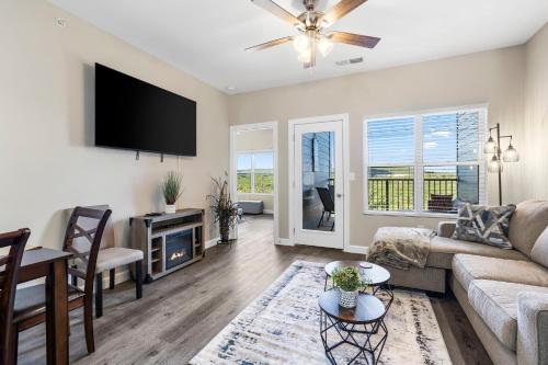 a living room with a couch and a tv at Vineyards Escape 3 in Branson