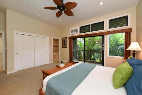 a bedroom with a bed and a large window at Kapalua Ridge Villas 1521 in Kahana