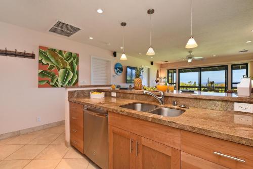 a kitchen with a sink and a counter top at Kaanapali Plantation 8 in Lahaina