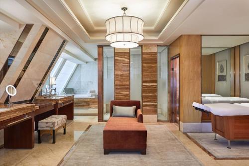 a bathroom with a vanity and a sink and a mirror at The Westin Xiamen in Xiamen