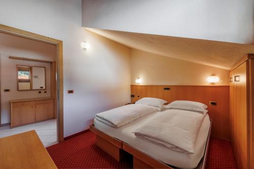 Postel nebo postele na pokoji v ubytování Hotel Miravalle