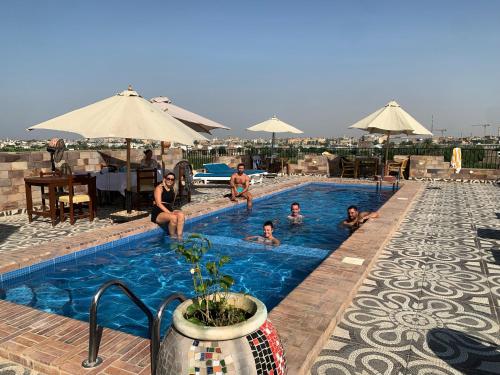 a group of people in a swimming pool at Nile Panorama Hotel in Luxor