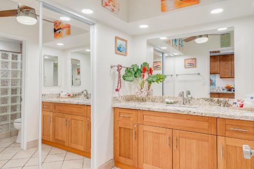 a bathroom with two sinks and a shower at Eldorado J222 in Kahana