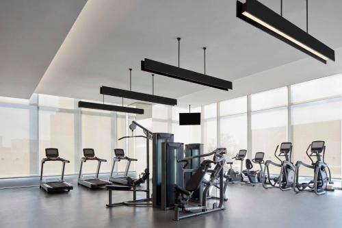 a gym with a row of exercise bikes at Jiaxing Marriott Hotel in Jiaxing