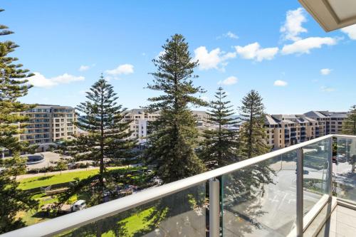 a balcony with trees and buildings at Belle Escapes - Aquarius on Colley Terrace 2 bed-2bath with sea views in Glenelg
