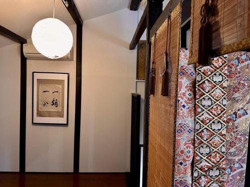 a hallway with a wall of tiles on the wall at CHELSEA24 in Kyoto