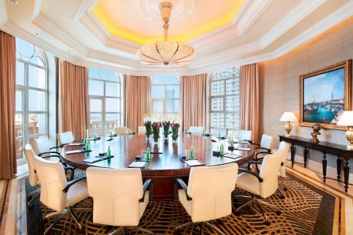 a large dining room with a large table and chairs at The Castle Hotel, a Luxury Collection Hotel, Dalian in Dalian