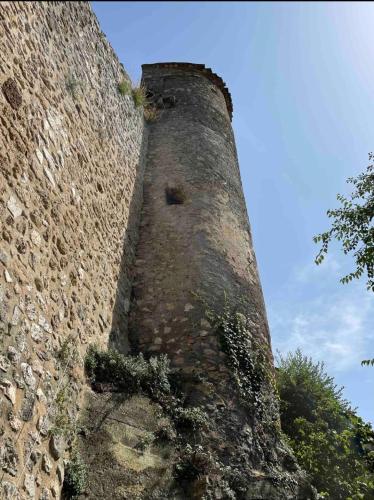 a tall brick wall with a sky in the background at Medieval Penthouse with Sunset Panoramic Views in Giove