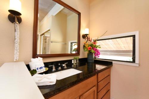 a bathroom with a sink and a mirror at Napili Point C40 in Kahana