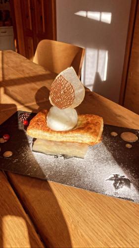 a mushroom on top of a piece of bread on a table at Hôtel Dents de Veisivi in Haudères