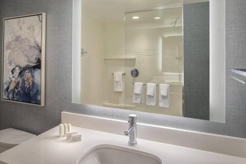 a bathroom with a sink and a mirror at Residence Inn by Marriott Stamford Downtown in Stamford