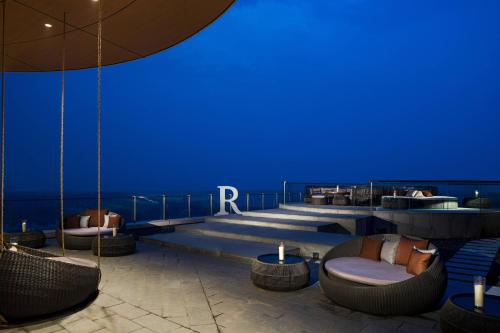 a blue room with chairs and tables on a building at Renaissance Suzhou Taihu Lake Hotel in Suzhou