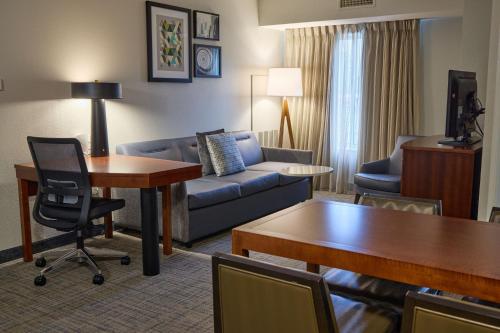 a living room with a couch and a table at Residence Inn by Marriott Columbia Northwest/Harbison in Columbia