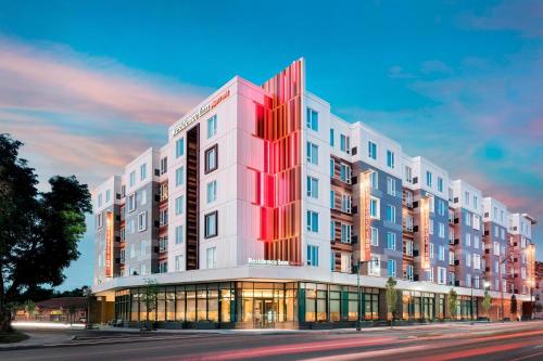 a rendering of a large white building on a street at Residence Inn by Marriott Boston Watertown in Watertown