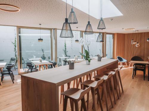 a bar in a restaurant with chairs and tables at Montreux Youth Hostel in Montreux