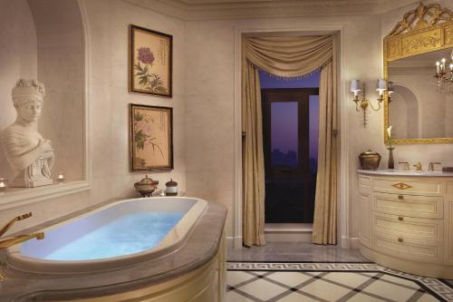 a large bathroom with a tub and a window at The Ritz-Carlton, Tianjin in Tianjin