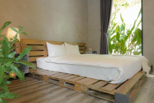Postel nebo postele na pokoji v ubytování Babylon Mini Resort