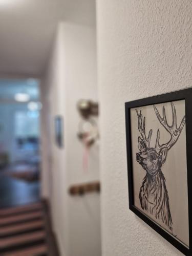 a drawing of a deer on a wall at Manjana`s Waldblick in Braunlage