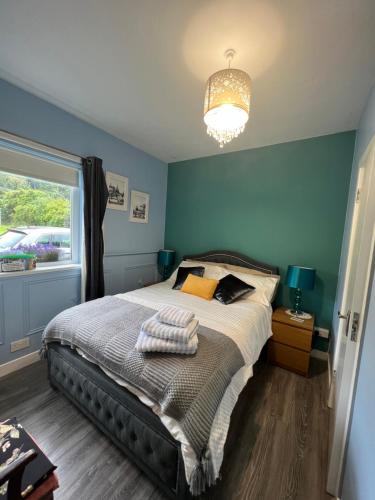 a bedroom with a bed and a window at Double bed Small En-suite for 2 in Killybegs