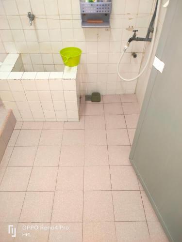 a bathroom with a tub and a sink and a shower at HrL Homestay Kangar in Kangar