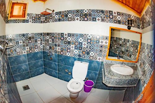 a bathroom with a toilet and a sink at Yasmina Beach in Taba