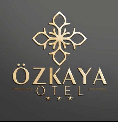 a gold logo with a snowflake on it at Özkaya hotel in Sivas