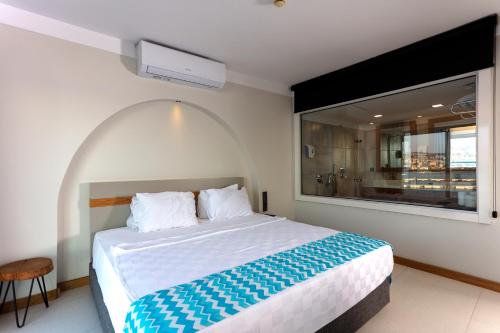 Ένα ή περισσότερα κρεβάτια σε δωμάτιο στο Efe Hotel