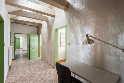 a dining room with a table and green doors at Huge 5-bedrooms apartment near Prague Castle in Prague