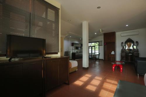 Televisyen dan/atau pusat hiburan di Blue Beach Apartment