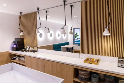 a large mirror in a dental office with a sink at The River Chalet in Sibiel