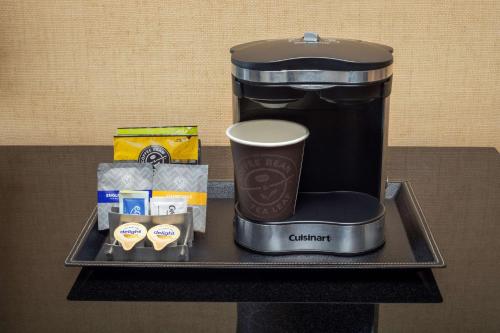 a coffee maker on a tray on a table at DoubleTree Boston North Shore Danvers in Danvers