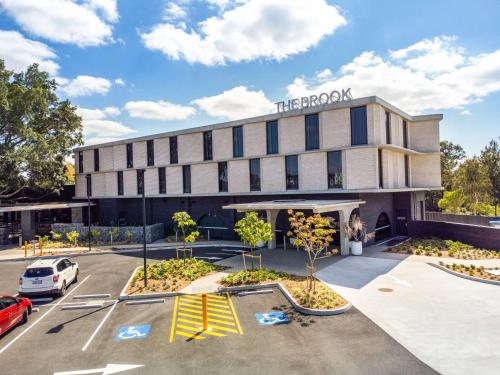 a rendering of the approach hotel in a parking lot at Nightelier Mitchelton The Brook in Brisbane
