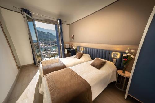 Кровать или кровати в номере Hotel Le Golfe