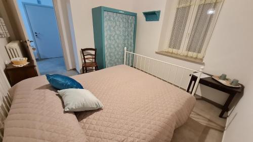 a bedroom with a bed with a pillow on it at Tana della Lavanda in Montefiorino