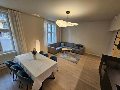 a living room with a table and a couch at Apartment with Balcony in Erling Skjalgssons in Oslo