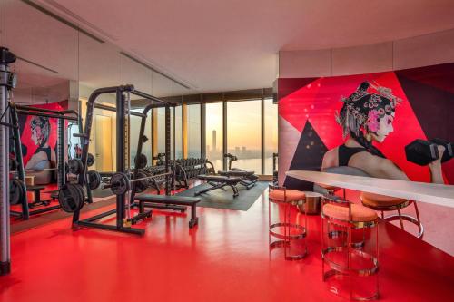 a fitness room with a gym with equipment at W Suzhou - Jinji Lake in Suzhou