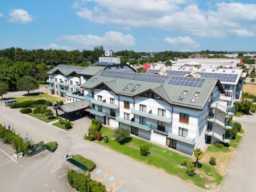 an aerial view of a building with solar panels on it at Best Western Modena District in Campogalliano