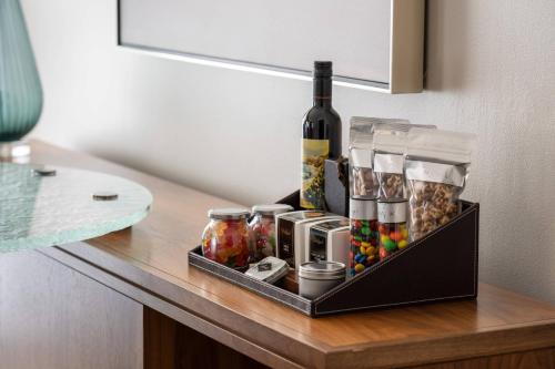 a tray with a bottle of wine and other items on a counter at The Ritz-Carlton, Sarasota in Sarasota