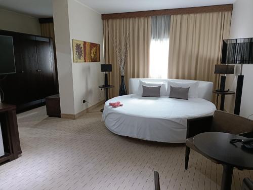 Posteľ alebo postele v izbe v ubytovaní Green Hotel Ninfa