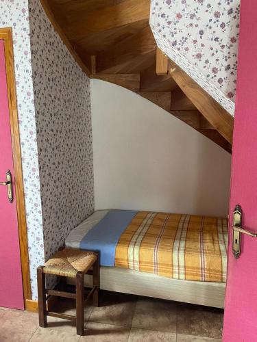 a bedroom with a bed and a bunk bed at Chez Patrick in Vitrac