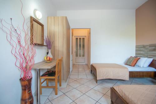 a bedroom with a bed and a desk in a room at Dora Studios Best Location In Laganas Next To The Party Area in Laganas