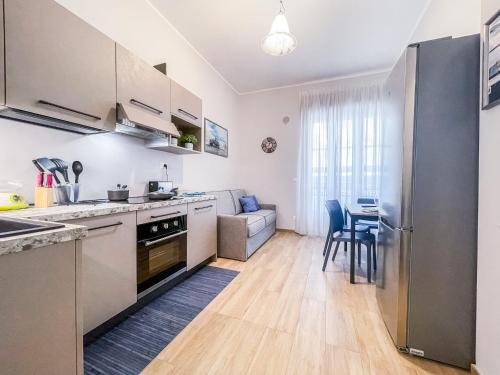 a kitchen with a table and a dining room at MYHOUSE INN 500 - Affitti Brevi Italia in Turin