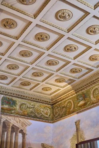 an ornate ceiling with gold and white ceilings at Duomo Luxury Florence in Florence