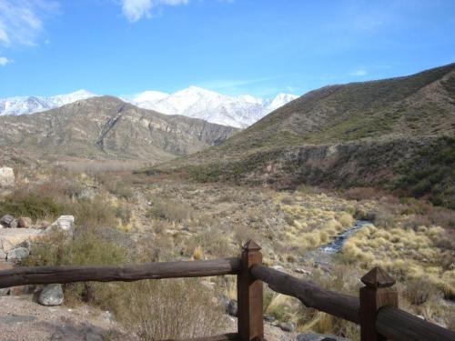 a wooden fence on top of a mountain at Las Margaritas in Potrerillos